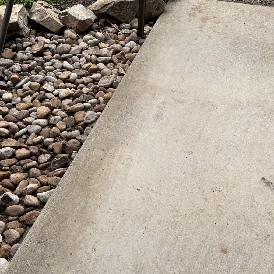 Clean patio concrete after pressure cleaning at an Airlie Beach holiday rental