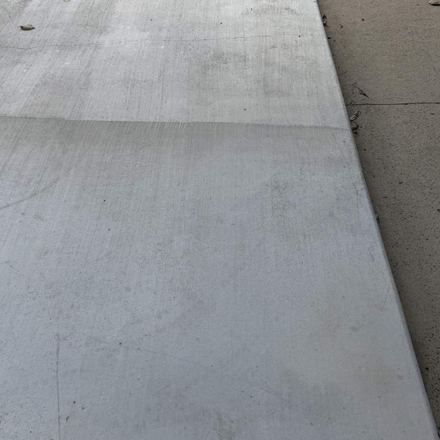 Pressure washed driveway slab with a clean finish in Airlie Beach